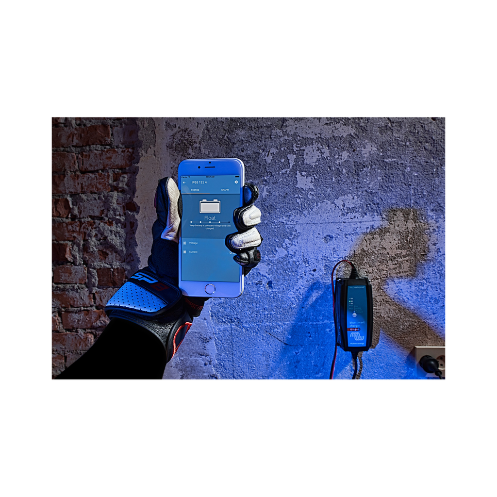 Blue Smart IP65 Charger motorcycle hand with iPhone.jpg